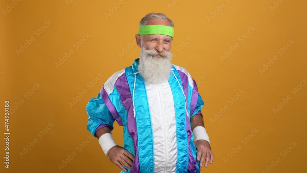 Middle aged man doing crossfit aerobics isolated vibrant color background Middle aged man doing crossfit aerobics isolated vibrant color background