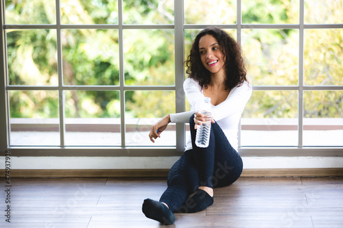 African American woman are workout exercise and drinking a water at fitness gym Free Download African American woman are workout exercise and drinking a water at fitness gym - GFXLoad
