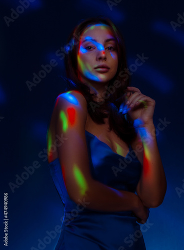 Portrait in the style of light painting. Brunette woman in blu dress long exposure photo, abstract portrait light and freezelight background