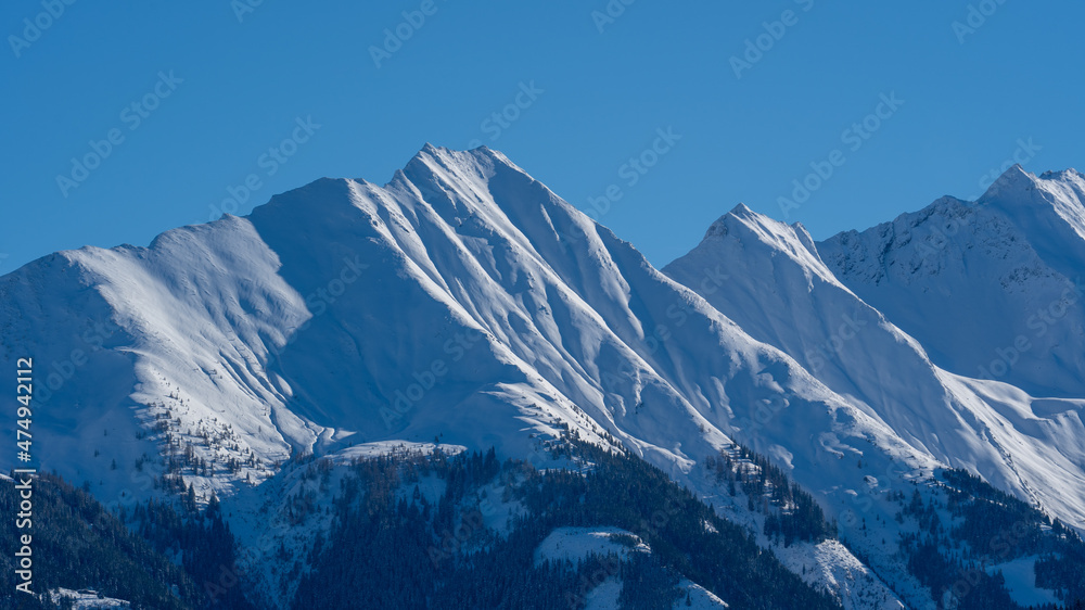 beautiful view of the snow capped hohe tauern in austria at a sunny  winter day