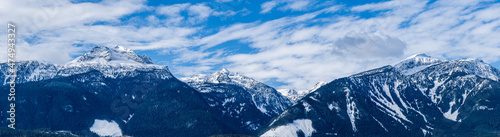 panorama of huge mountains covered by snow british columbia canada © olegmayorov