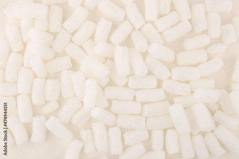 Styrofoam packing peanuts background. White plastic foam pellets protective for parcel packing. Styrofoam packing peanuts background. White plastic foam pellets protective for parcel packing.