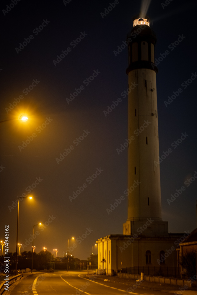beautiful floodlit lighthouse in the early evening in Dunkirk, France. High quality photo