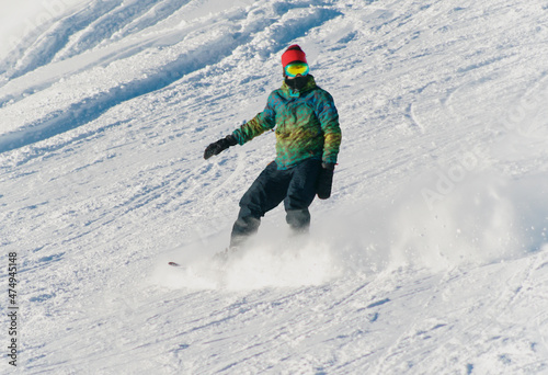 Snowboarder on the snowy slope