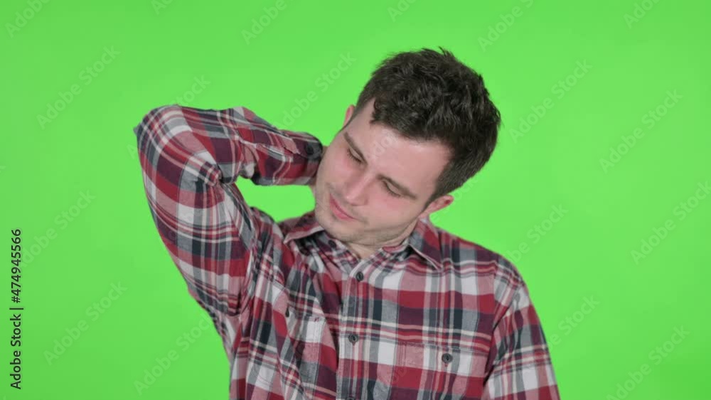 Portrait of Young Man having Neck Pain, Green Chroma Screen Portrait of Young Man having Neck Pain, Green Chroma Screen