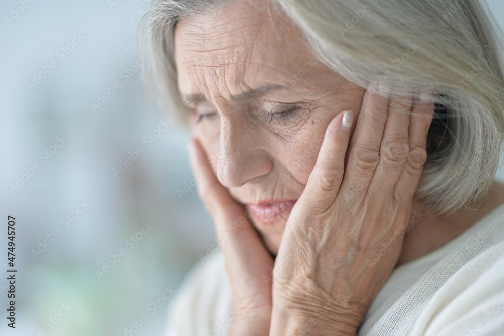 Portrait of sad senior woman with headache Portrait of sad senior woman with headache