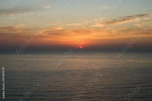 The sun's disk rises over the sea horizon. The Mediterranean Sea near Mersin, Turkey. Travel and tourism concept