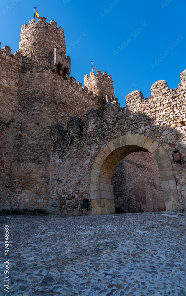 Low Angle View of Entrance to Spanish Castle With Clear Blue Skies