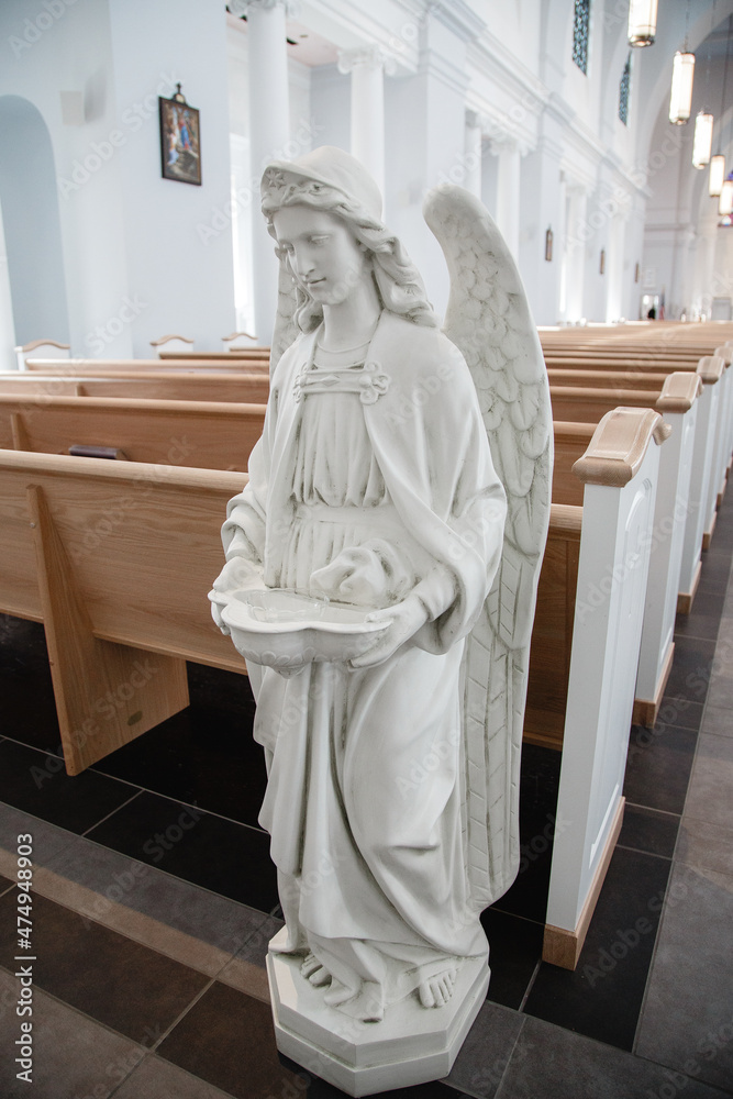 Sculpture of an angel in the catholic church Statue of white angel
