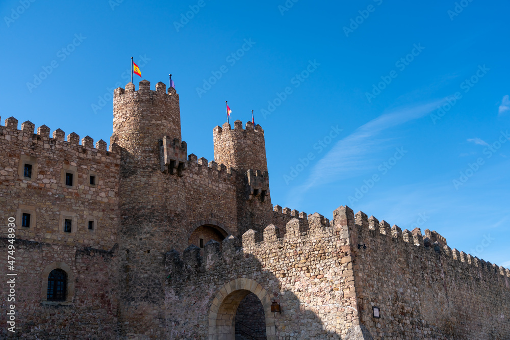 View of the External Wall of LArge Castle and Arch Entrance With Clear Blue Skies
