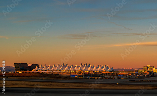 Fotografija Denver International Airport at dusk against the sunset sky