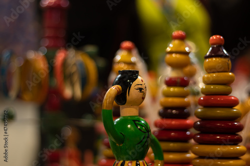 Multicolored Toy For New Born Babies Infants Or Kids Portraying Traditional Cultural Indian Women In Ethnic Dress. Eco Friendly Wooden Handmade Wooden Channapatna Ring Toys Originating From Karnataka