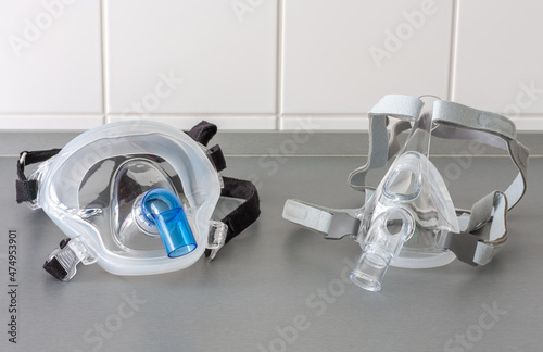 Two types of non-invasive ventilation face mask, close up view, in ICU in hospital.
