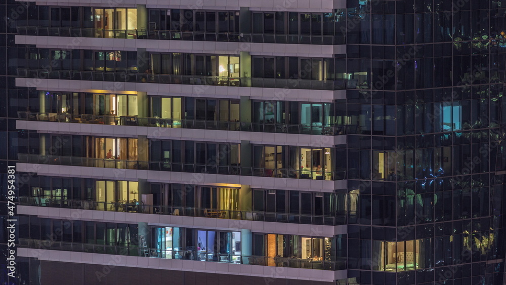 Windows lights in modern residential buildings timelapse at night Windows lights in modern residential buildings timelapse at night