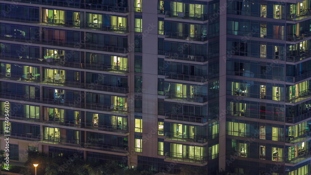 Windows lights in modern office and residential buildings timelapse at night Windows lights in modern office and residential buildings timelapse at night