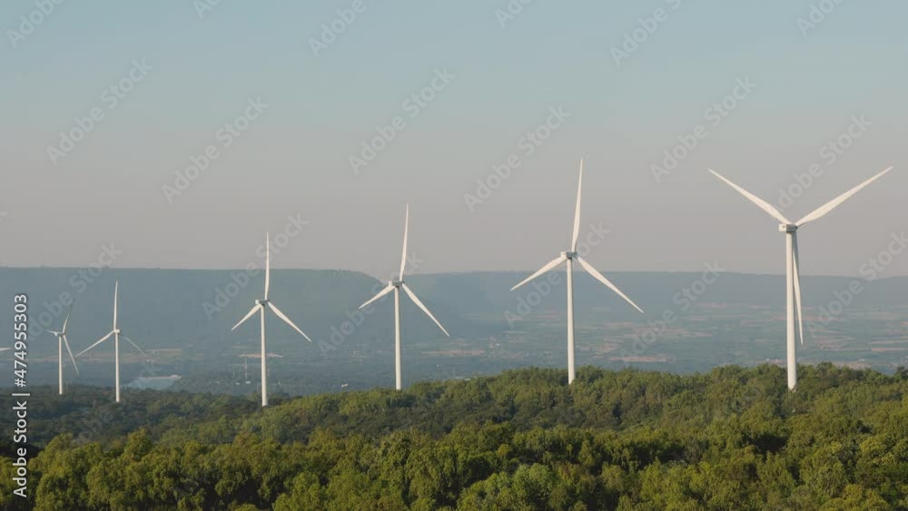 Nakhon Ratchasima/ Thailand-December 6: Rows of EGAT windmills on December 6, 2021. Windmills on the hill convert wind energy to electricity to supply alternative source for electrical usage. Nakhon Ratchasima/ Thailand-December 6: Rows of EGAT windmills on December 6, 2021. Windmills on the hill convert wind energy to electricity to supply alternative source for electrical usage.