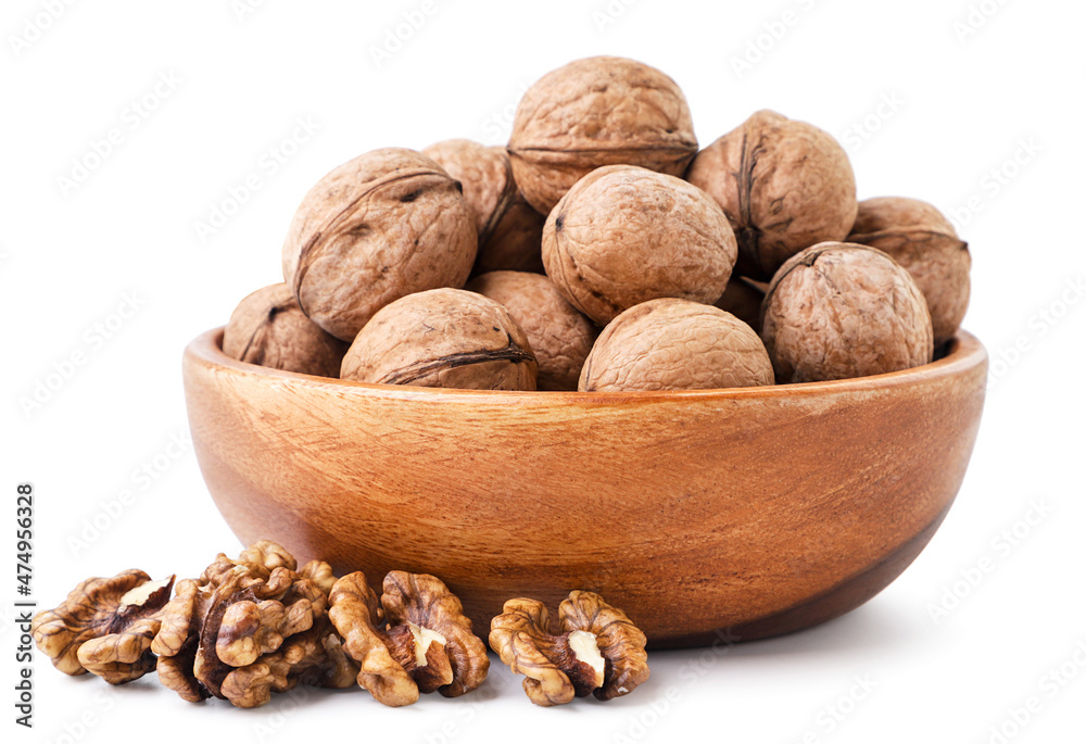 Whole walnut in a plate on a white background. Isolated Whole walnut in a plate on a white background. Isolated