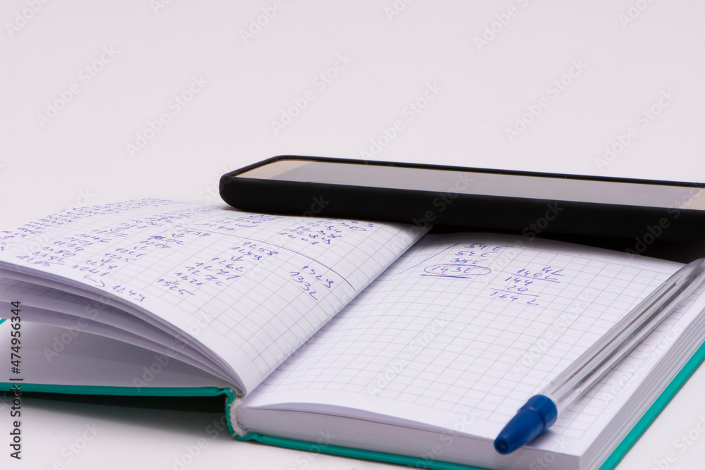 Notebook pen and phone isolated on white background Notebook pen and phone isolated on white background