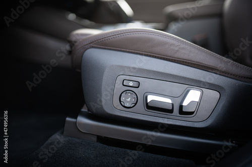  Detail view of the buttons which control the driver seat position inside a premium luxury car.