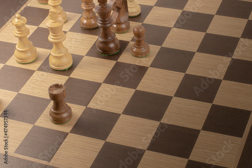 Chessboard with figures, business strategy concept.