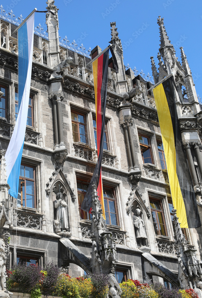 Three flags symbolizing the colors of the city of Munich and the Region of Bavaria and the nation of Germany