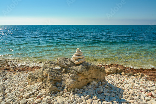 Pyramid of stones on the seashore.