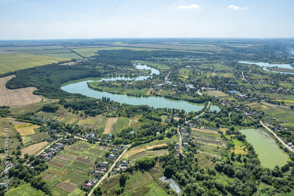Aerial view of town with river and nature