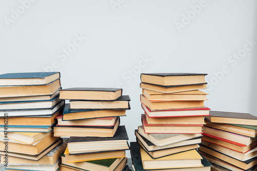 Stacks of books for teaching knowledge of the college university library white background © dmitriisimakov