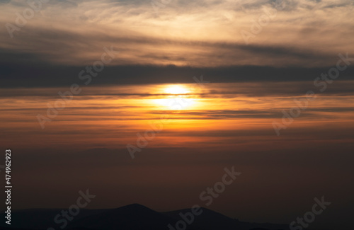 Beautiful golden sunset over the mountains.  © Inga Av