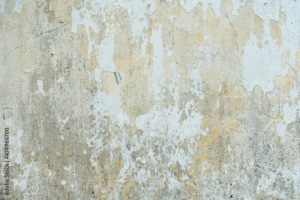 Empty background is an old painted concrete wall. The texture of the wall with cracks, lichen and mold. A destroyed building after a cataclysm or tornado. Empty background is an old painted concrete wall. The texture of the wall with cracks, lichen and mold. A destroyed building after a cataclysm or tornado.