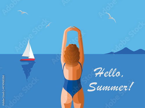 Girl standing by back at front a beach