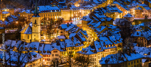 Obraz na płótnie Alleys and lanes of the town center of Bern in winter blue hour with snow-covered roofs and illuminated buildings in Christmas season, Rosengarten, Bern, UNESCO, Switzerland w salonie