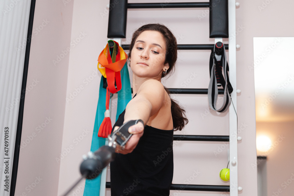 Concept of rehabilitation. Beautiful young woman doing exercises on mat Concept of rehabilitation. Beautiful young woman doing exercises on mat