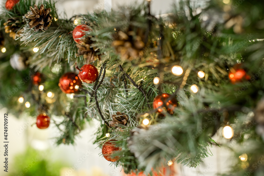 Christmas outdoor background with fir tree branches, decorations and blurred lights on back. Selective focus Christmas outdoor background with fir tree branches, decorations and blurred lights on back. Selective focus