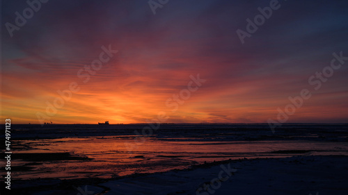 sunset in the sea beyond the polar circle