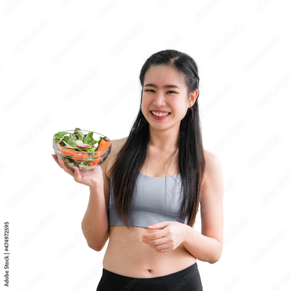 Portrait of happy healthy Asian woman in sportswear standing smiling and holding salad bowl in the kitchen at home isolated on white background with clipping path. Portrait of happy healthy Asian woman in sportswear standing smiling and holding salad bowl in the kitchen at home isolated on white background with clipping path.