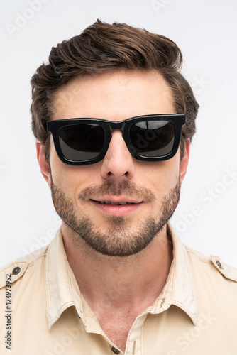 portrait of a man, with sunglasses, studio shot