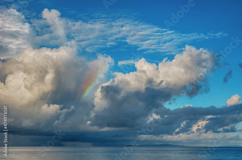Rainbow over the ocean and tropical island