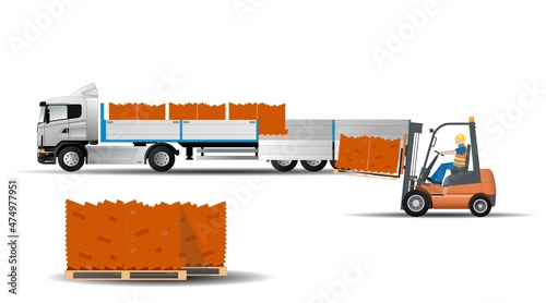 A forklift unloads a machine with building bricks on potdons, side view. Logistics and delivery of goods.