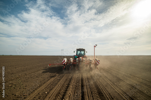 Sowing crops at agricultural fields in spring