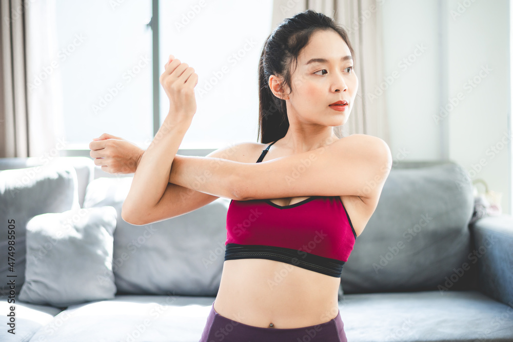 young woman doing exercise at home, fitness sport for body building and training, active happy girl