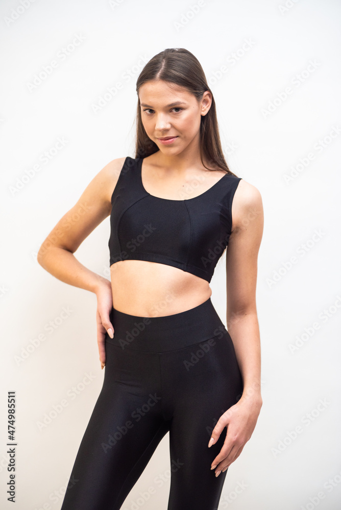 High fashion portrait of young fit elegant woman wearing black clothes. High fashion portrait of young fit elegant woman wearing black clothes.