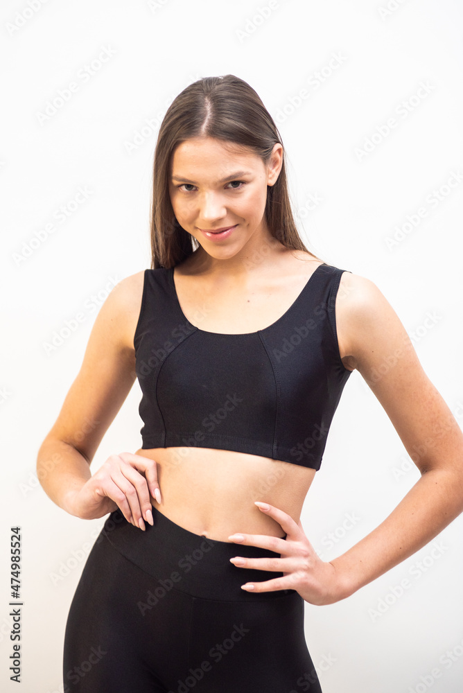 High fashion portrait of young fit elegant woman wearing black clothes. High fashion portrait of young fit elegant woman wearing black clothes.