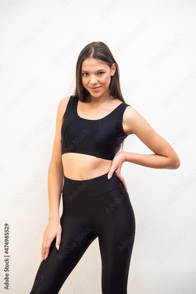 High fashion portrait of young fit elegant woman wearing black clothes. High fashion portrait of young fit elegant woman wearing black clothes.
