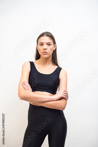 High fashion portrait of young fit elegant woman wearing black clothes. 