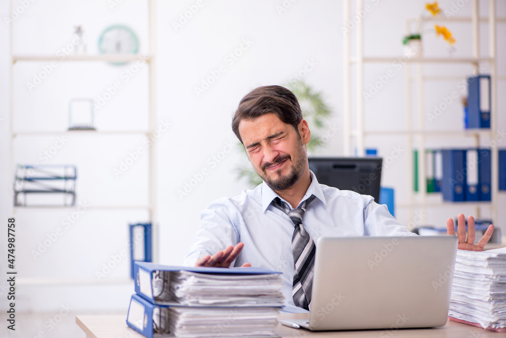Young businessman employee working in the office Young businessman employee working in the office