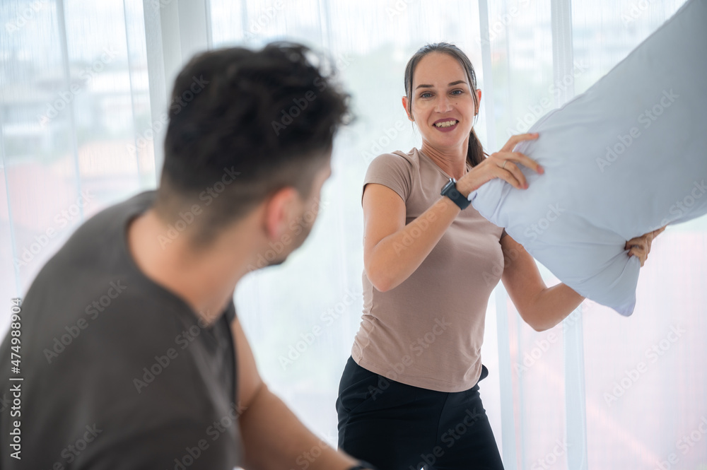 couple person wife and husband are happy love together and fun to playing in bed room at home couple person wife and husband are happy love together and fun to playing in bed room at home
