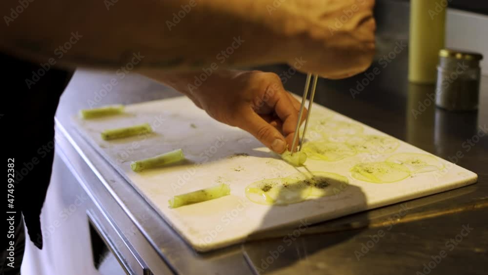 Chef preparing appetizer of apple slices, lemon and olive oil Chef preparing appetizer of apple slices, lemon and olive oil