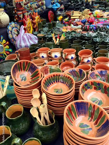 pottery in the market. clay pots in the market of Nochixtlan in the state of Oaxaca, Mexico. plates, cups, colorful handmade pots for sale. 