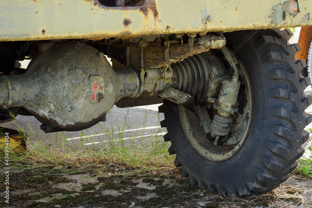 A military truck old with a detail on the front axle. A military truck old with a detail on the front axle.